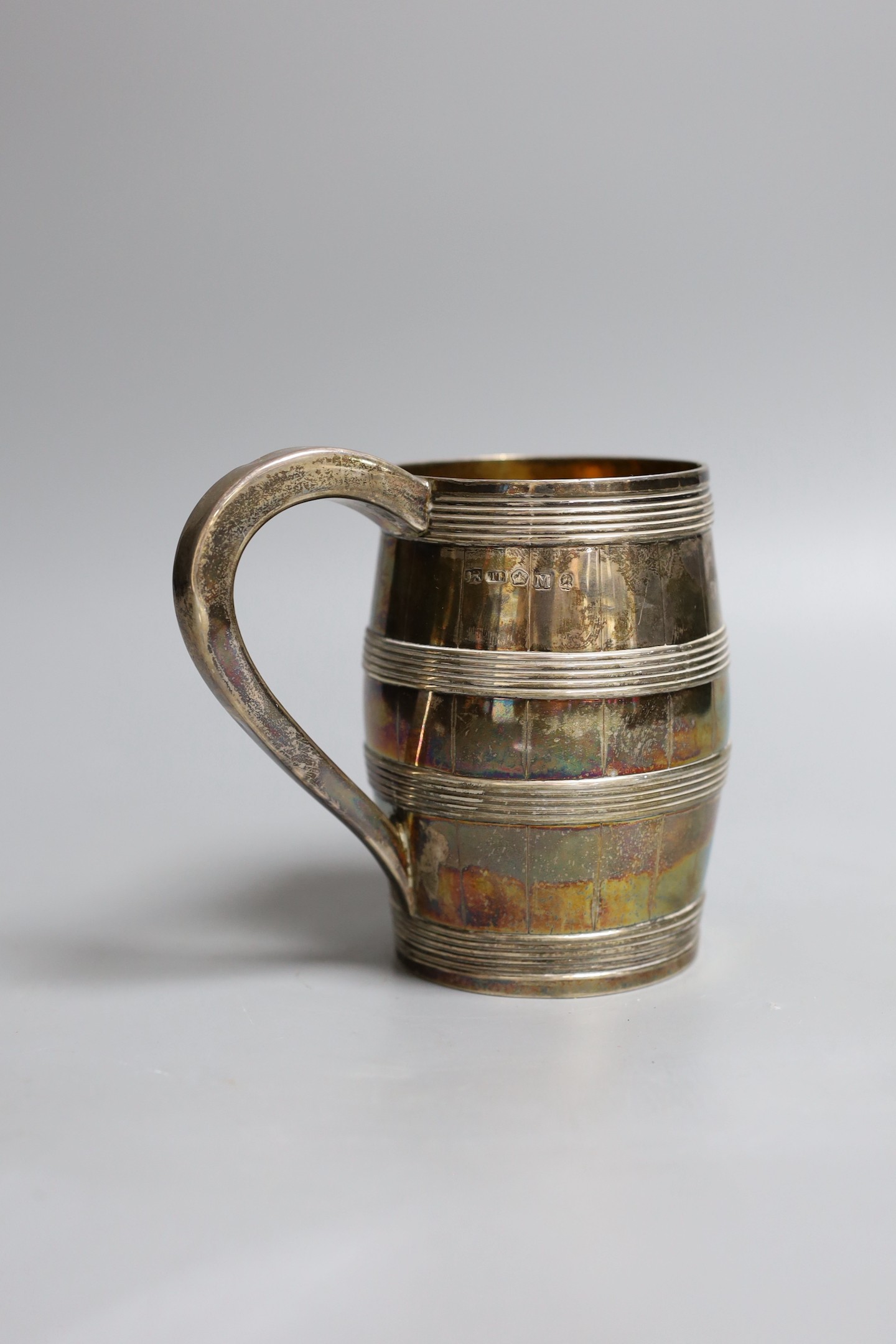 A George III silver barrel shaped pint mug, with reeded bands, Thomas Law, Sheffield, 1802, 12.7cm, 9.50z.